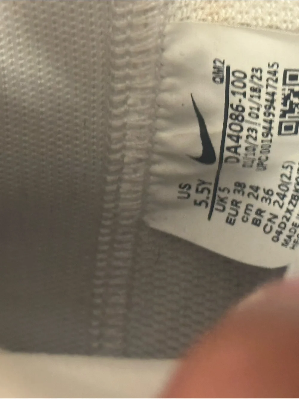 Nike Women's White High-Top Sneakers with Black Swoosh